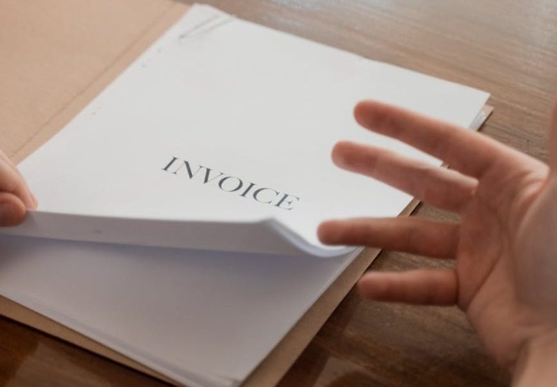 white papers in brown folder